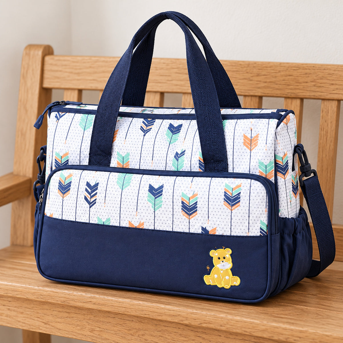 Deep Blue Starling bag with shoulder strap on an oak bench