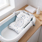 Lumiwee Starry baby bath support mat: starry print bath support mat clipped into an empty baby tub
