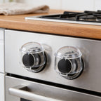 Lumiwee Stove knob covers: two clear knob covers fitted on stove knobs