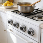 Lumiwee Stove knob covers: clear knob covers on all four front knobs of a range