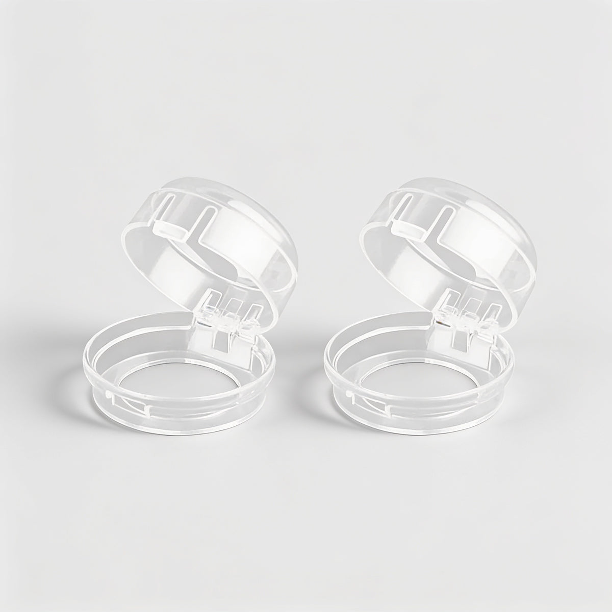 Lumiwee Stove knob covers: two clear stove knob covers on a plain background