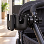 Empty black cup holder mounted on a round stroller frame tube
