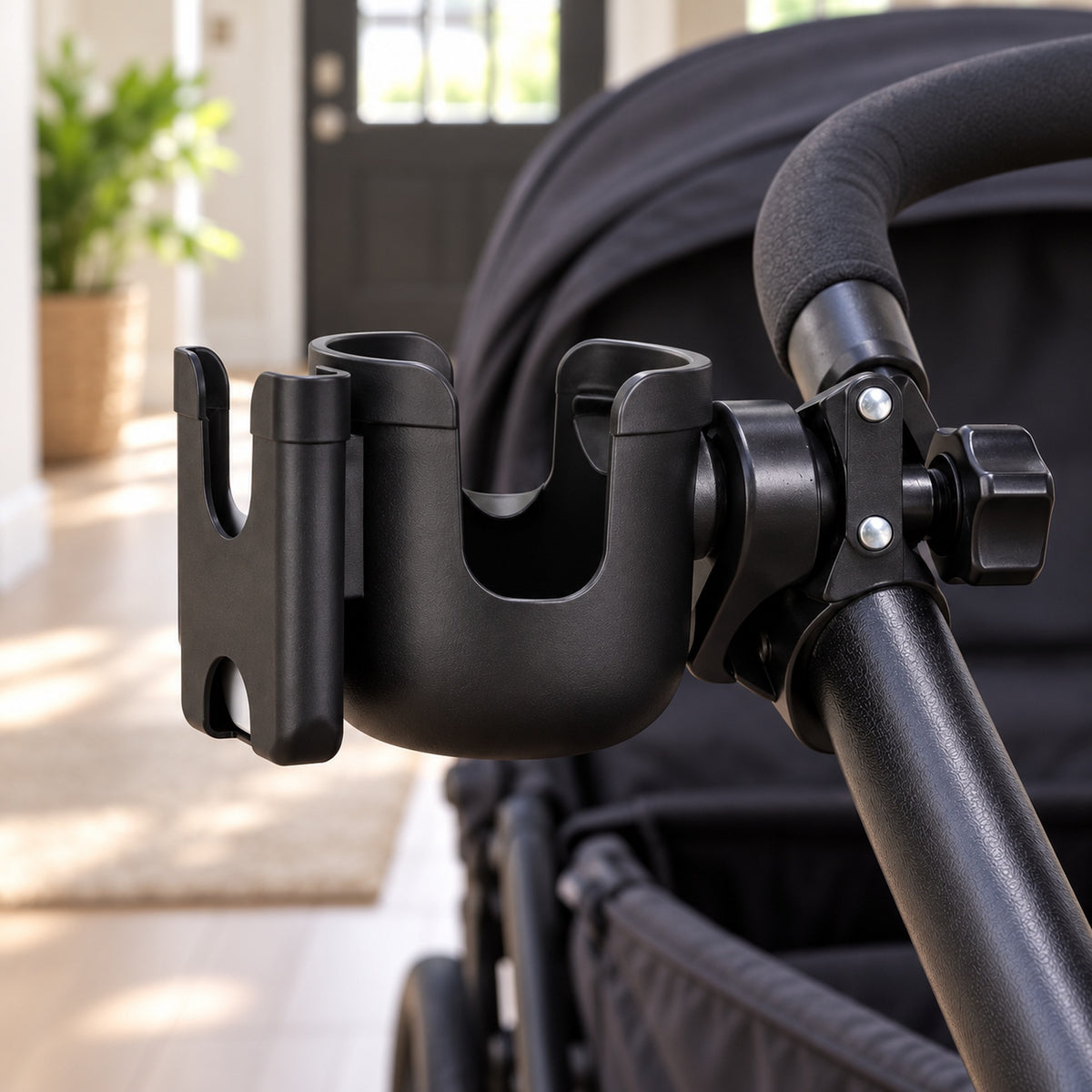 Empty black cup holder mounted on a round stroller frame tube