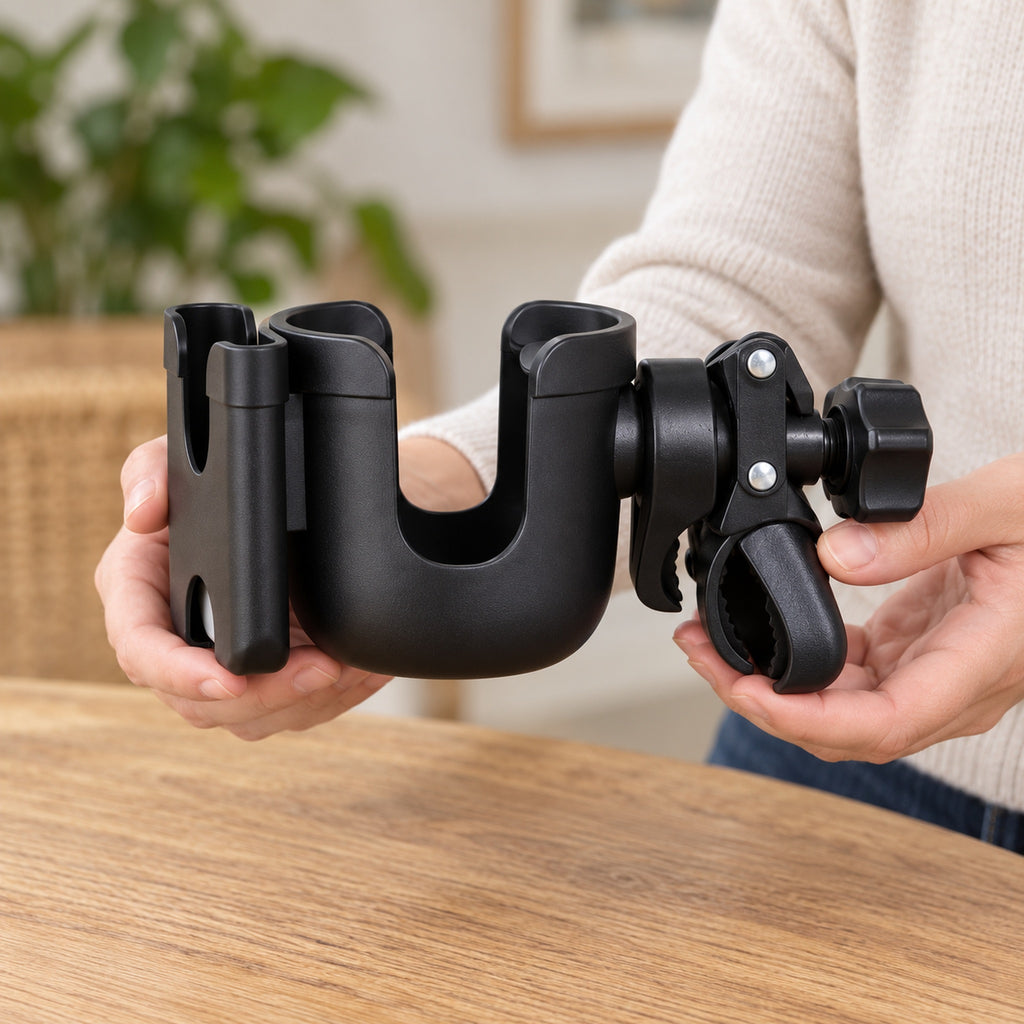 Adult holding the empty black cup holder for scale