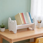 Lumiwee Sunny kids book rack: white smiley book rack holding books on a kids desk