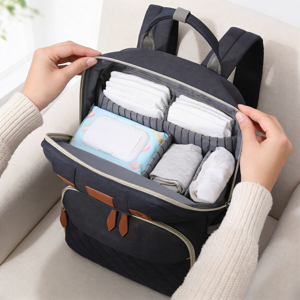 Lumiwee Swift diaper backpack: unzipped main compartment with diapers, wipes and spare clothes