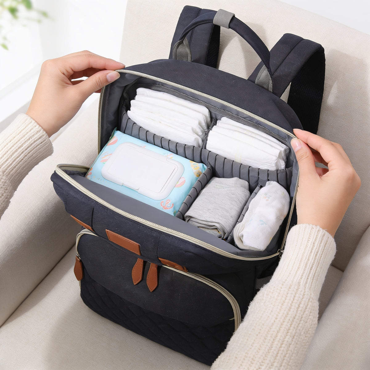 Lumiwee Swift diaper backpack: unzipped main compartment with diapers, wipes and spare clothes