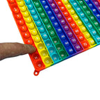 Finger pressing an original Tally multiplication board bubble