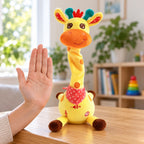 Yellow Tilly giraffe beside an adult hand for scale