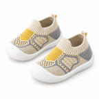 Khaki sock shoe pair on a white background