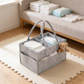 Lumiwee Tuck felt diaper caddy tote: grey felt diaper caddy stocked with diapers and wipes on a play mat