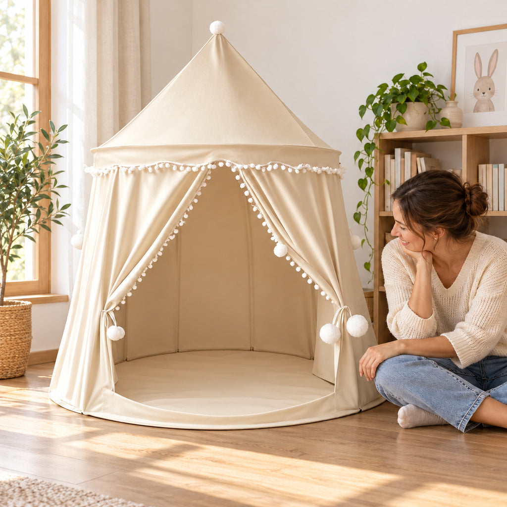 Beige castle tent beside a seated adult for scale