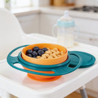 Lumiwee Twirl 360 rotating baby bowl: teal rotating snack bowl with blueberries on a high-chair tray