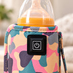 Close view of Pink camouflage fabric, stitched edging and actual power button