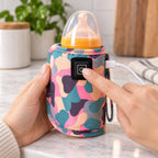 Adult pressing the Pink warmer's single power button